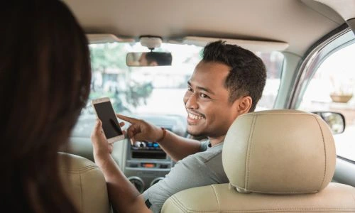 Customer booking a taxi with 24/7 cab availability service in Dehradun