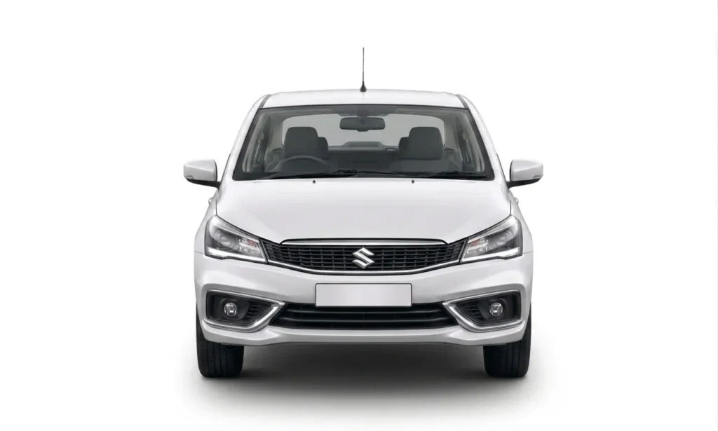 Front view of a white Maruti Suzuki Ciaz sedan available for taxi service in Mussoorie.