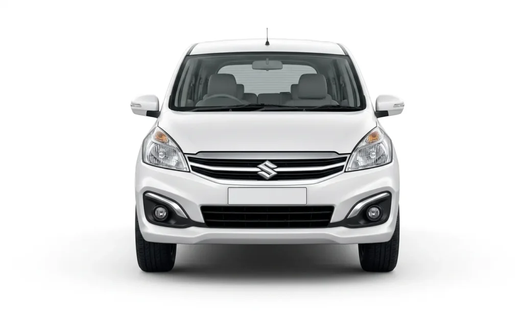 Front view of a white Maruti Suzuki Ertiga available for taxi service in Mussoorie.