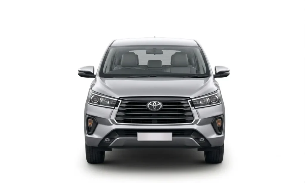 Front view of a reliable Toyota Innova taxi available for your trip, part of our premium taxi service in Mussoorie.